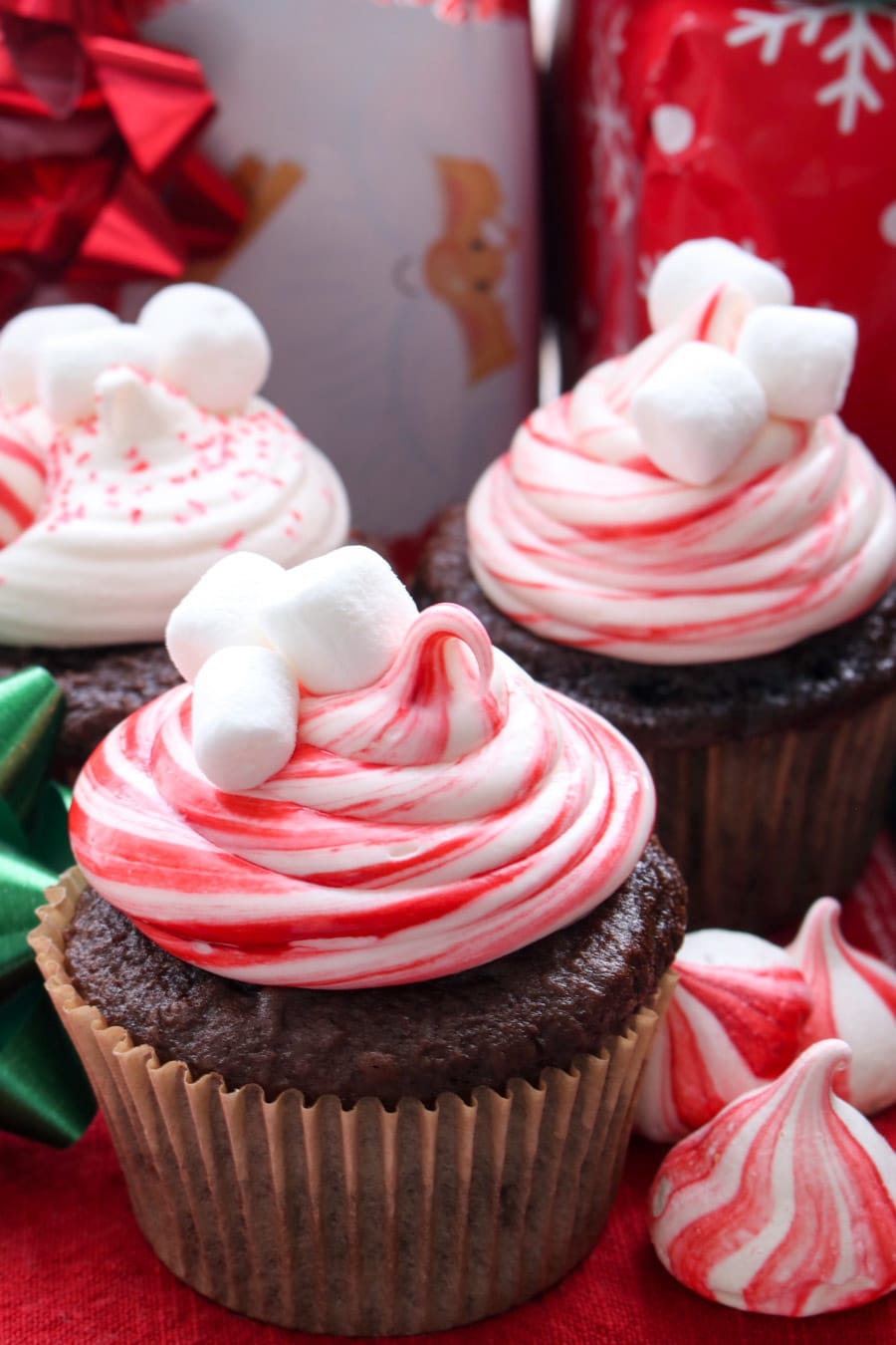 chocolate cupcake decorated with red and white swirl frosting