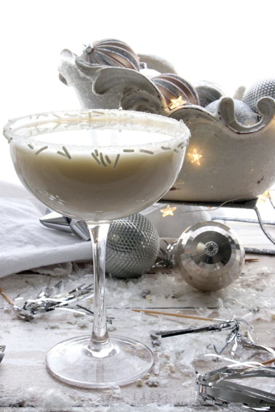 white chocolate martini with a sparkling sleigh in the background