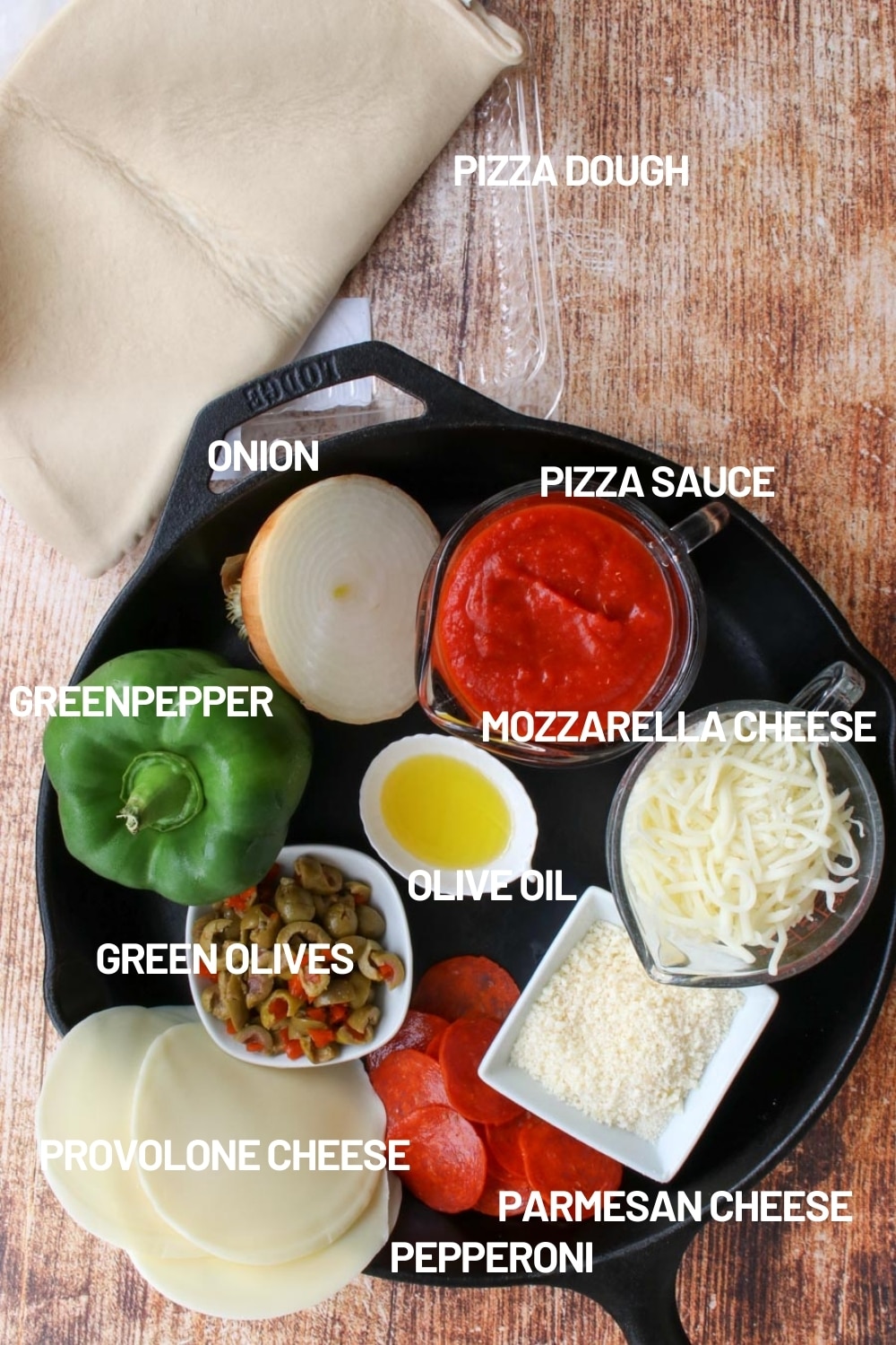 Skillet filled with pizza ingredients