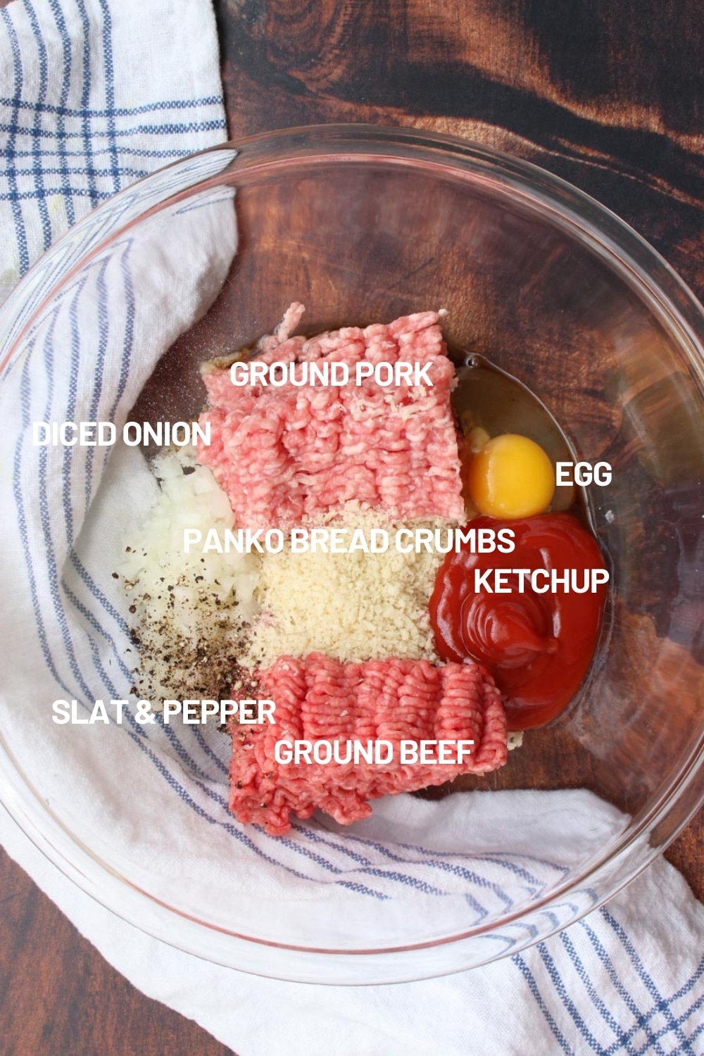 Clear glass bowl with the raw ingredients to make muffin tin meatloaf