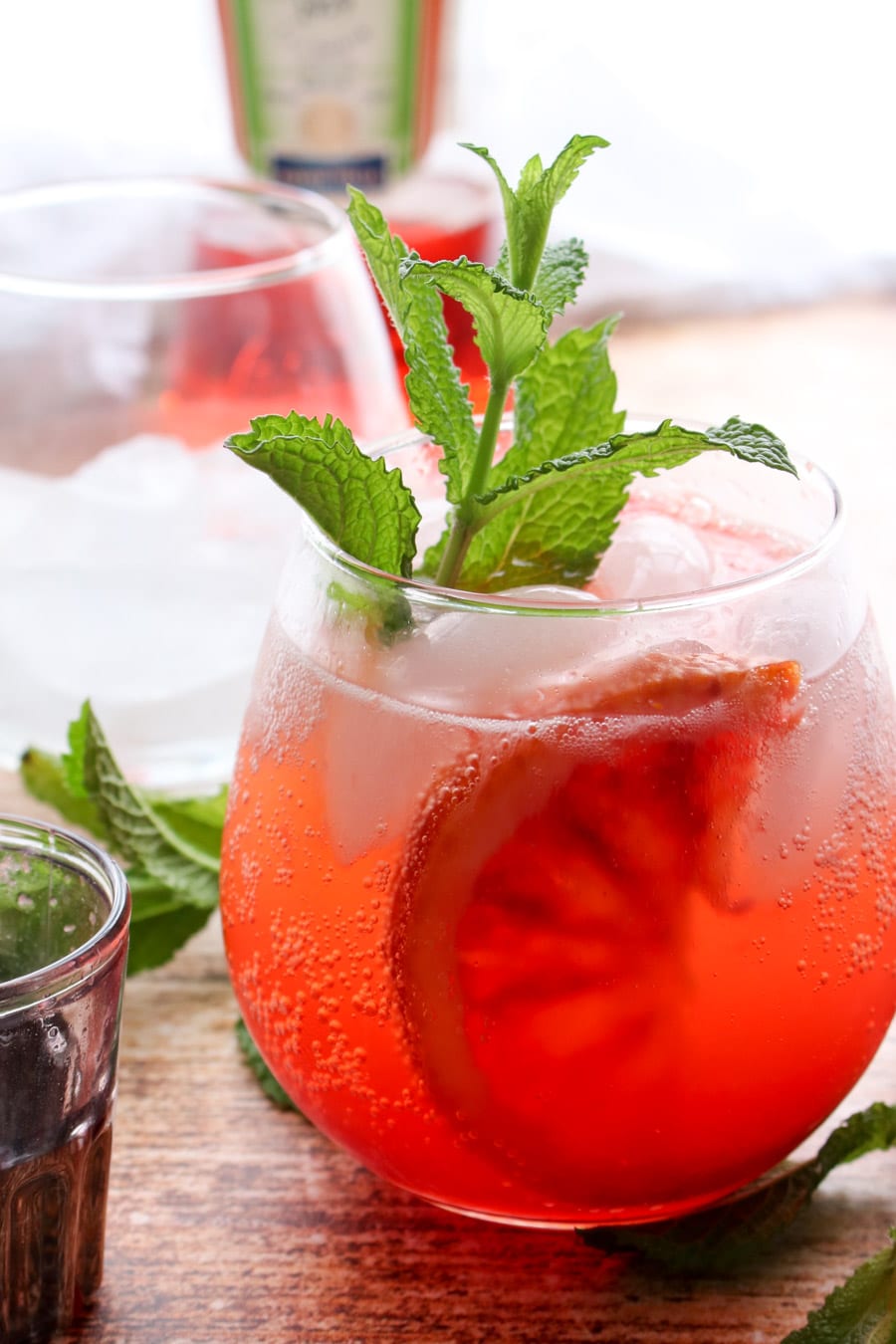 Orange cocktail with fresh mint and a slice of orange in glass