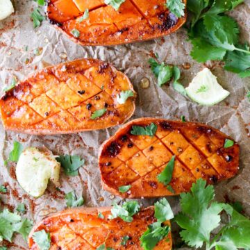 four roasted sweet potatoes with cilantro on top