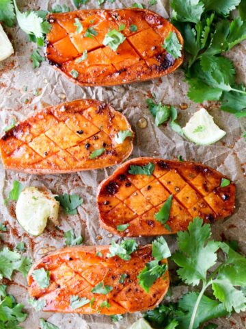 four roasted sweet potatoes with cilantro on top