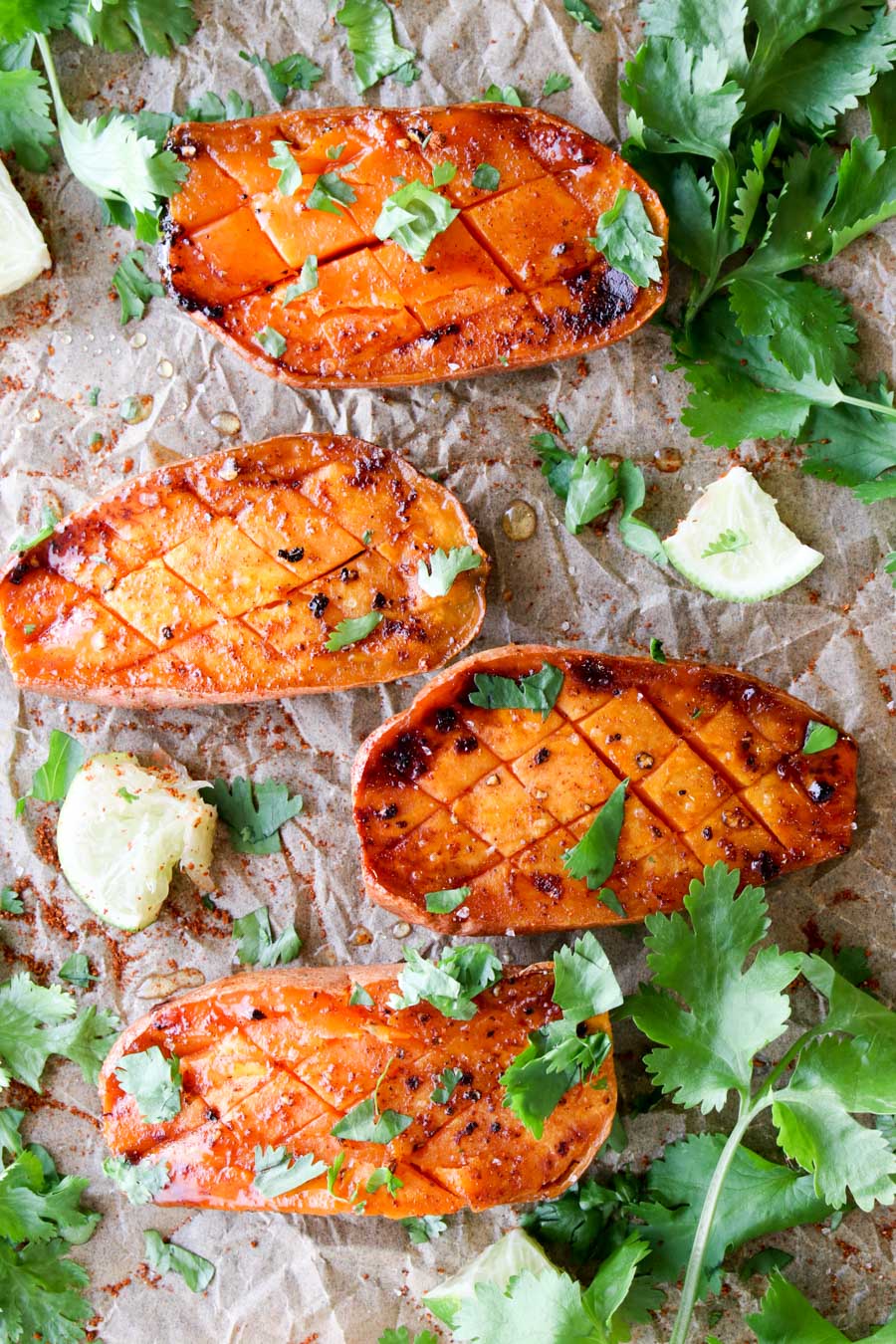 four roasted sweet potatoes with cilantro on top