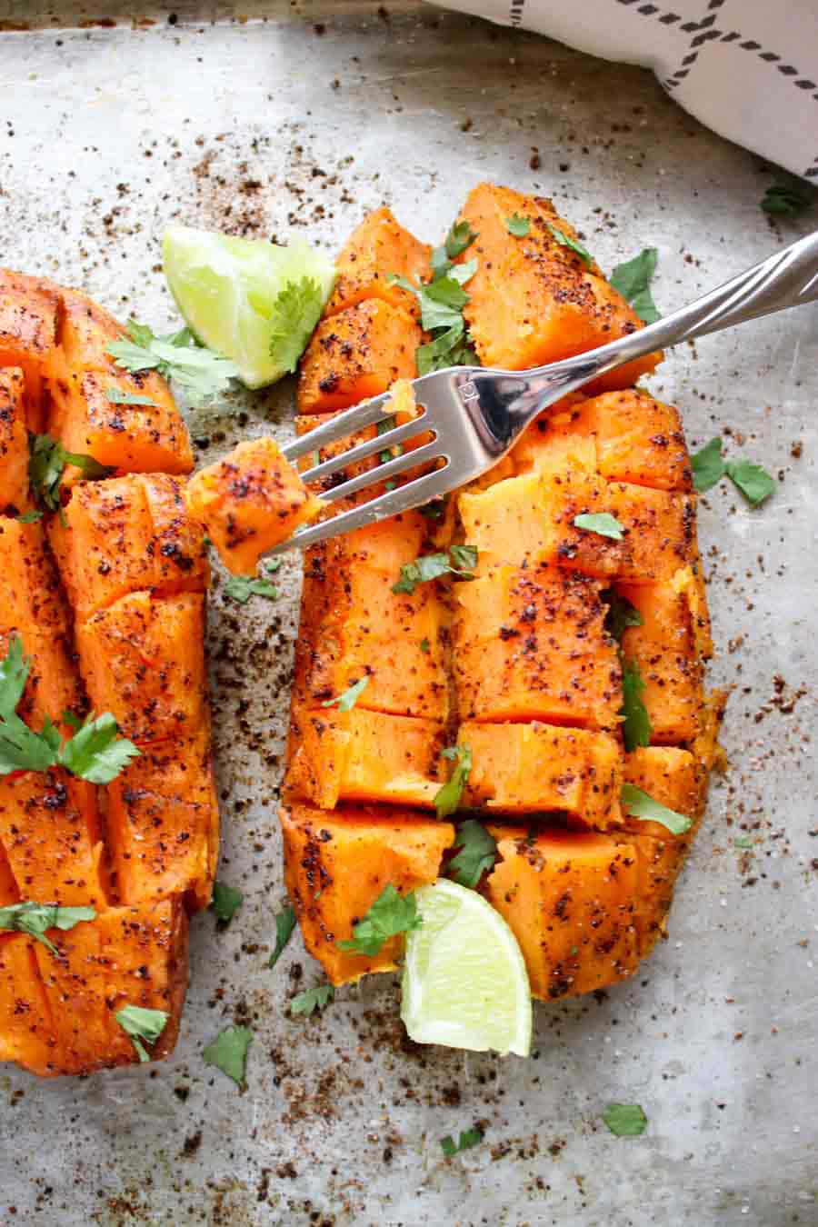 close up of a sweet potato and a fork