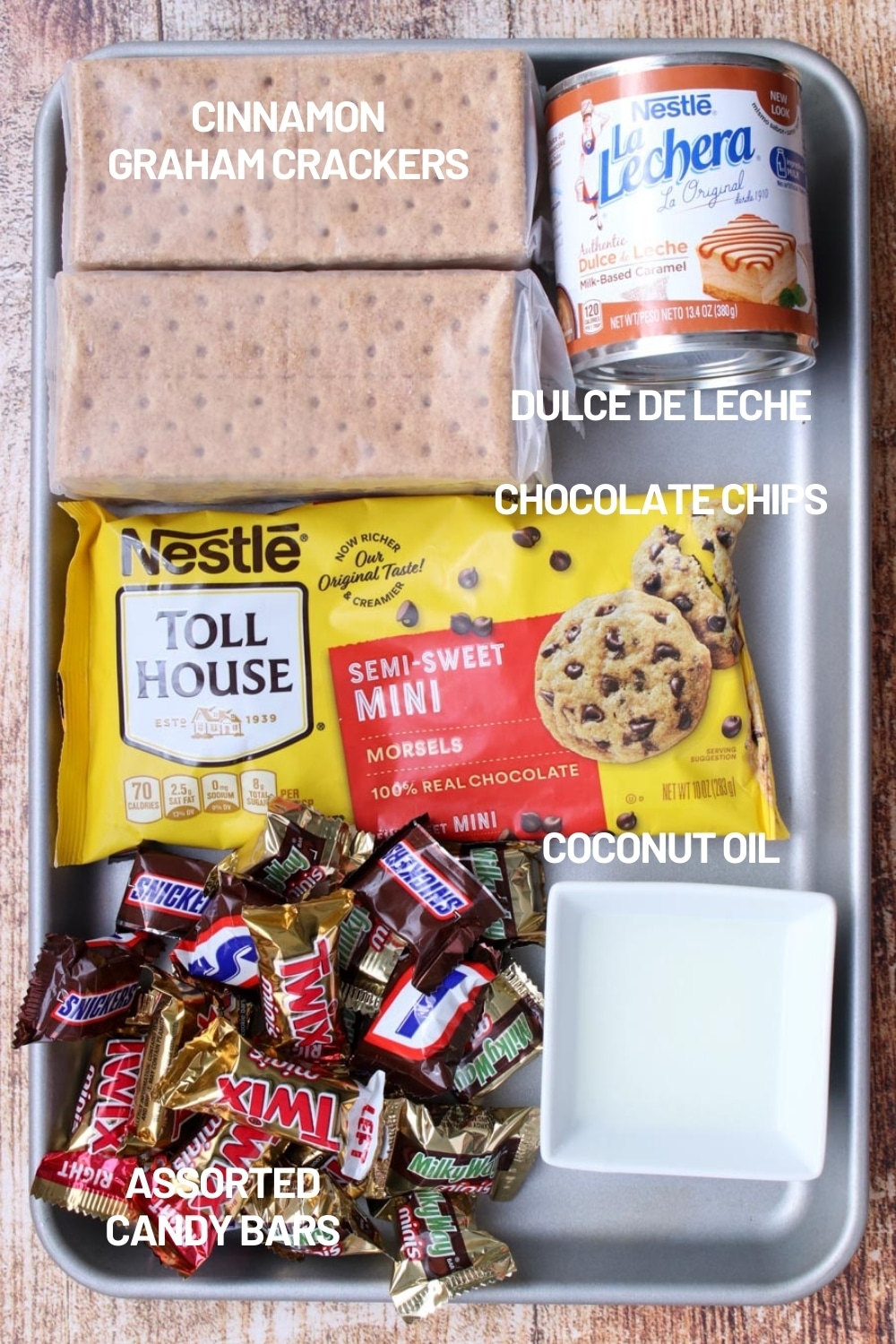 cookie sheet filled with ingredients to make chocolate caramel cookie bars