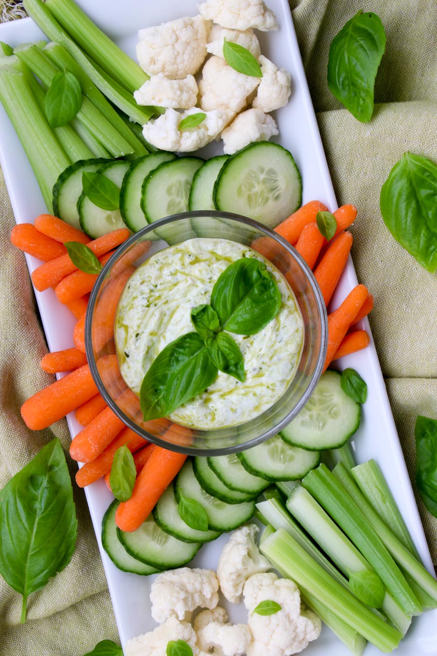 platter of veggies with a bowl of yogurt pesto dip