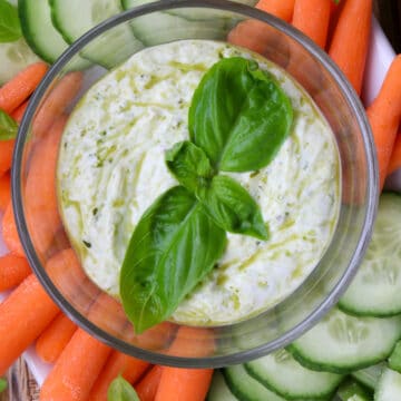 close up shot of a bowl of pesto yogurt dip