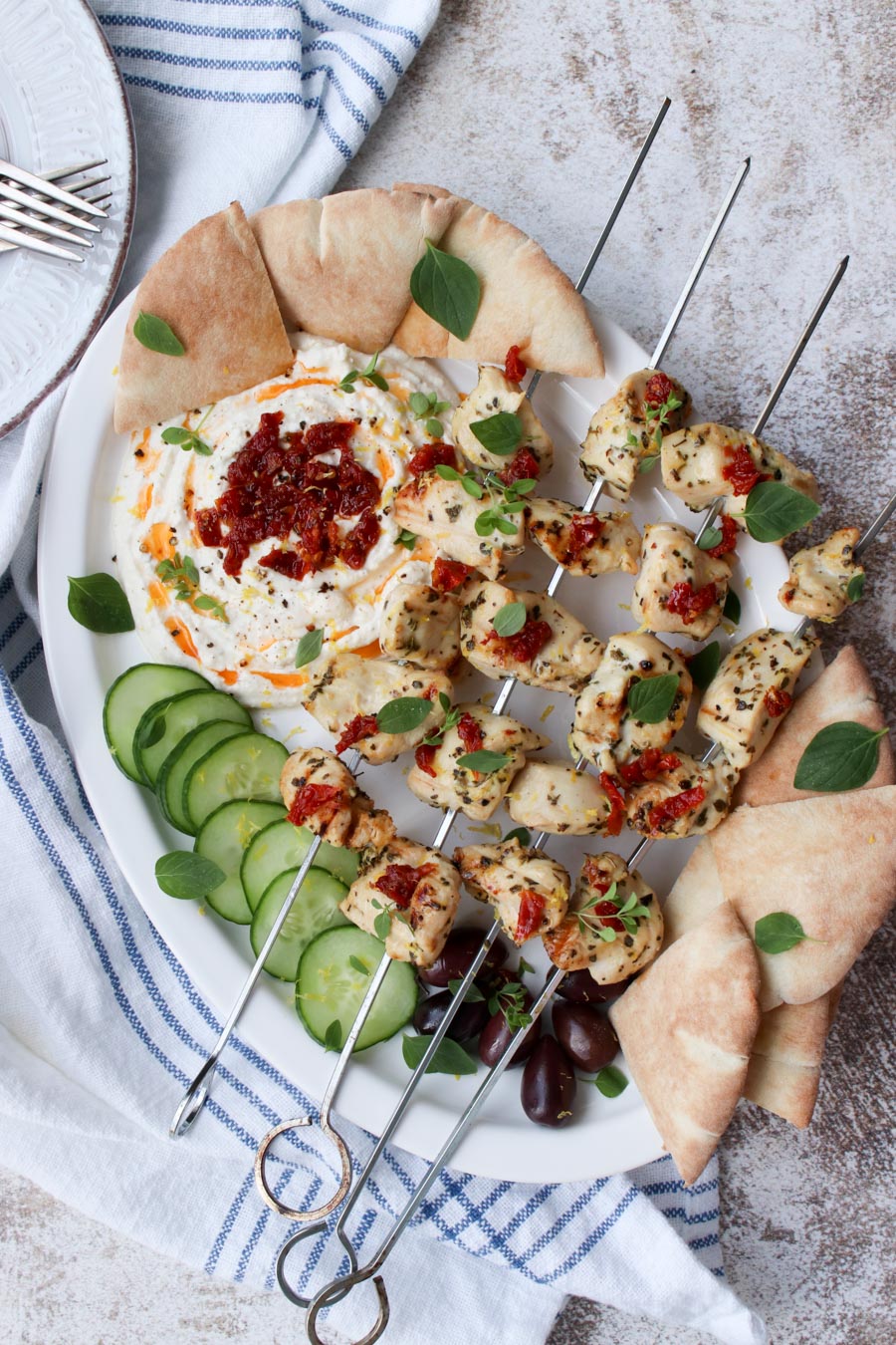 Platter with 4 chicken kabobs, whipped feta and pita bread