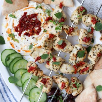 platter with chicken kabobs and whipped feta