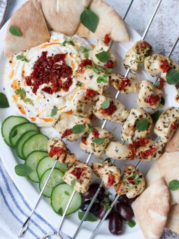 platter with chicken kabobs and whipped feta