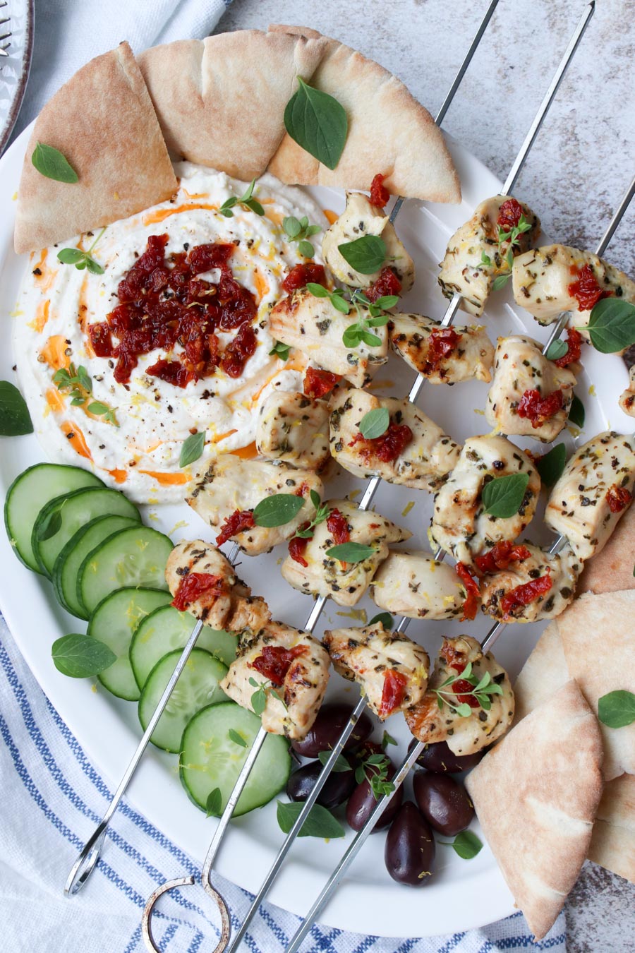 platter with chicken kabobs and whipped feta