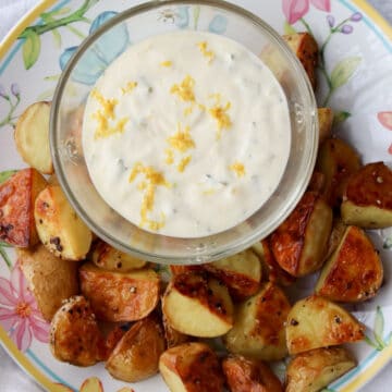 bowl of lemon aioli with roasted potatoes