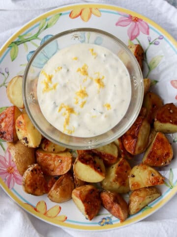 bowl of lemon aioli with roasted potatoes