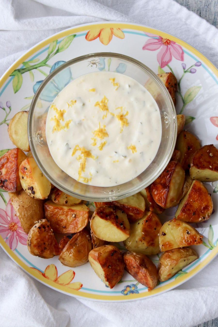 bowl of lemon aioli with roasted potatoes