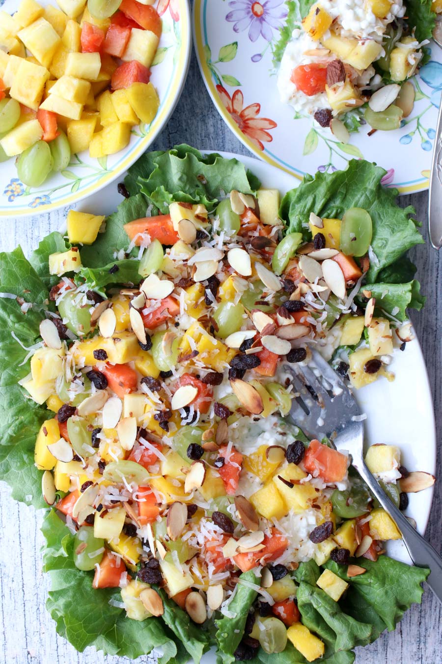 platter of tropical cottage cheese and a plate of fruit on the side