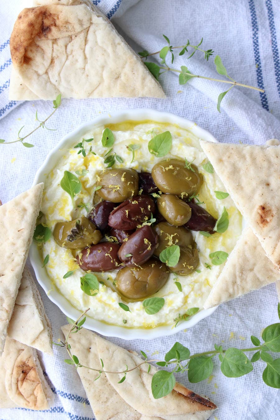 Bowl of whipped feta and olives and pita