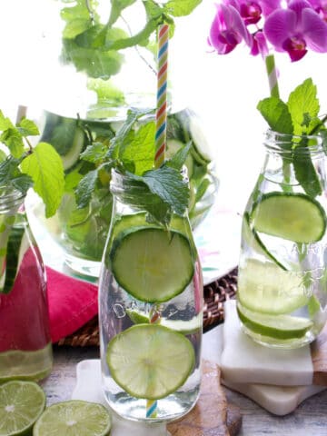 milk bottles of water with cucumber and mint