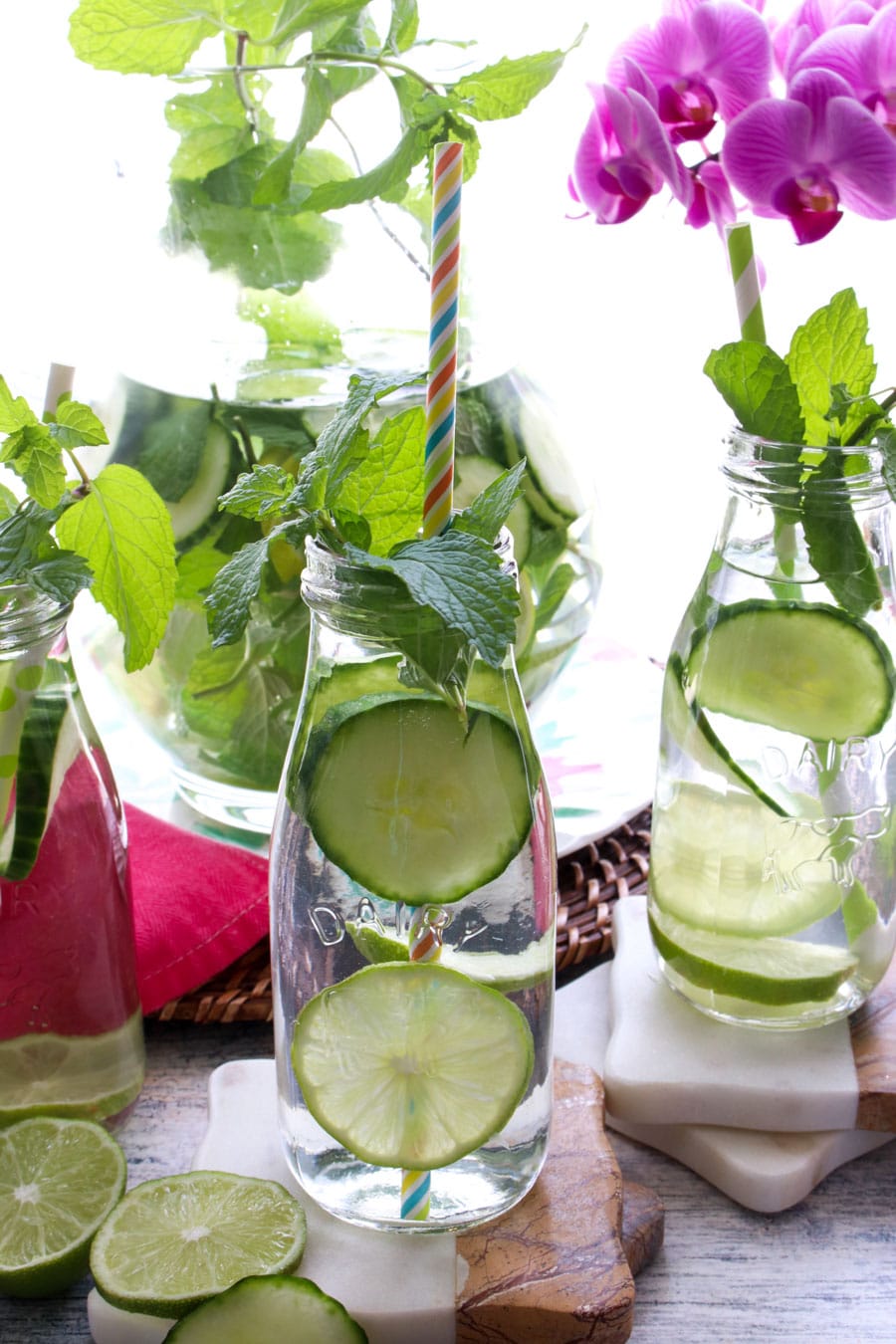 milk bottles of water with cucumber and mint