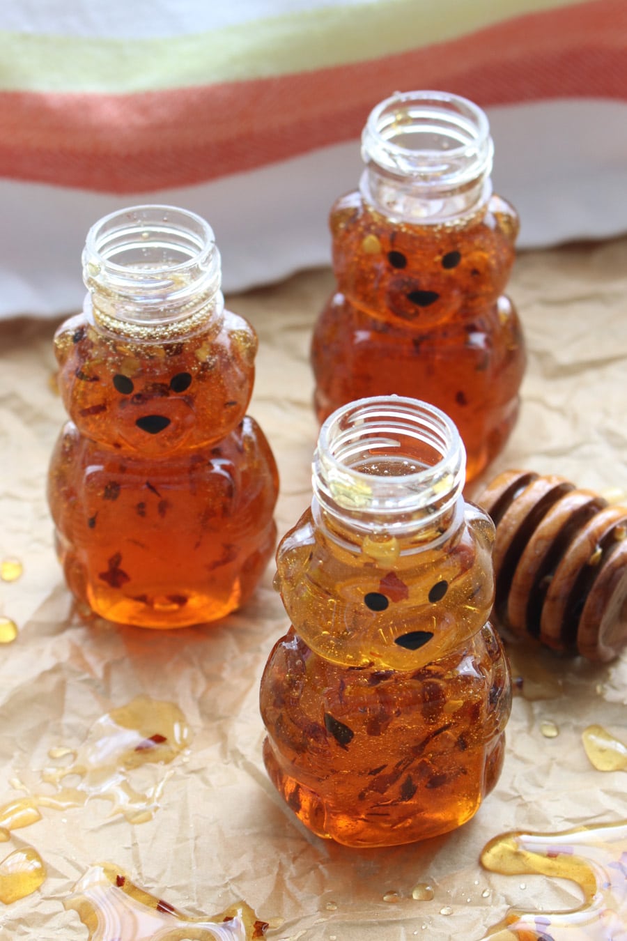 THREE SMALL BEAR JARS OF HONEY