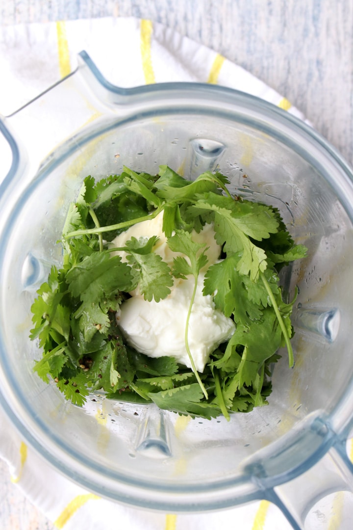 looking into blender full of cilantro lime sauce ingredients