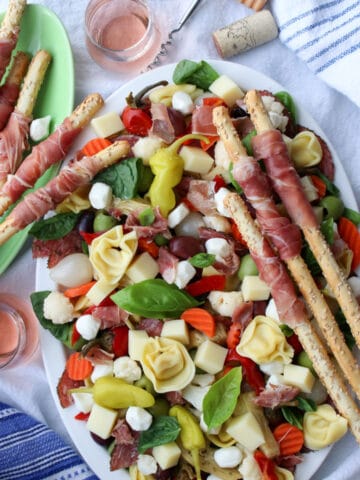 platter of antipasto salad with breadstick