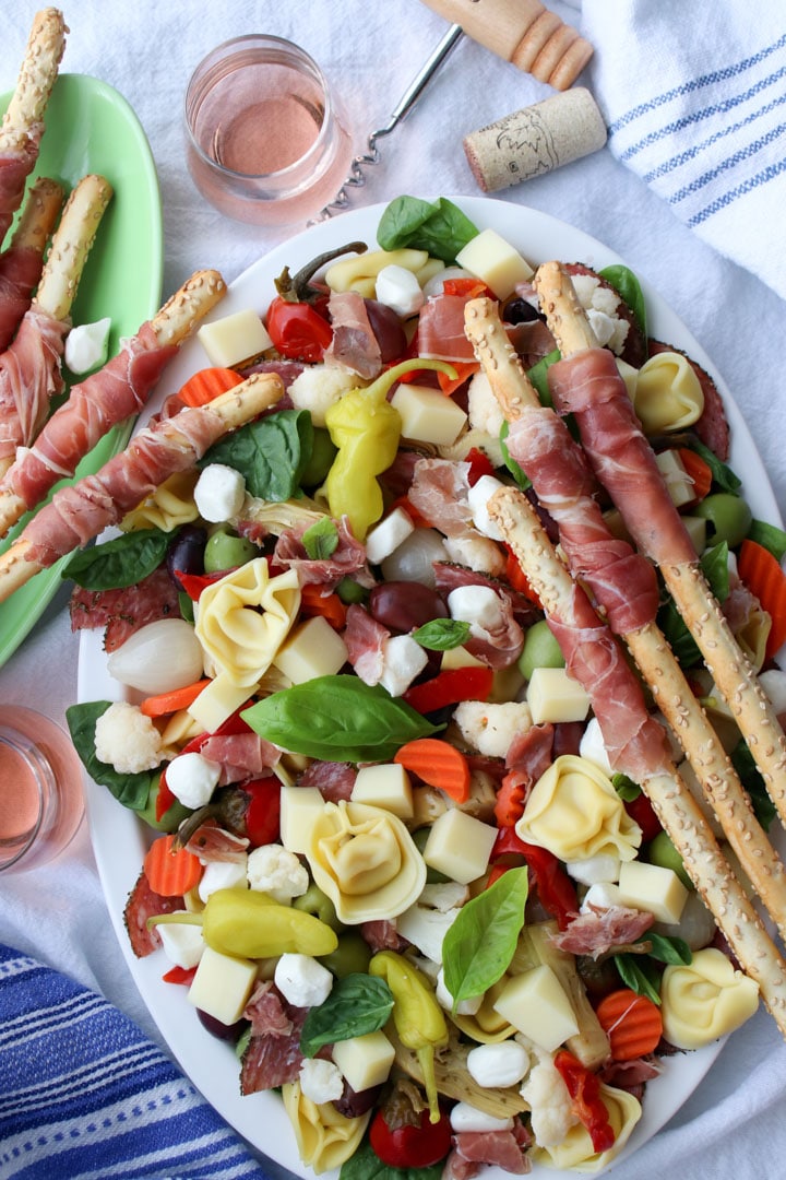 platter of antipasto salad with breadstick