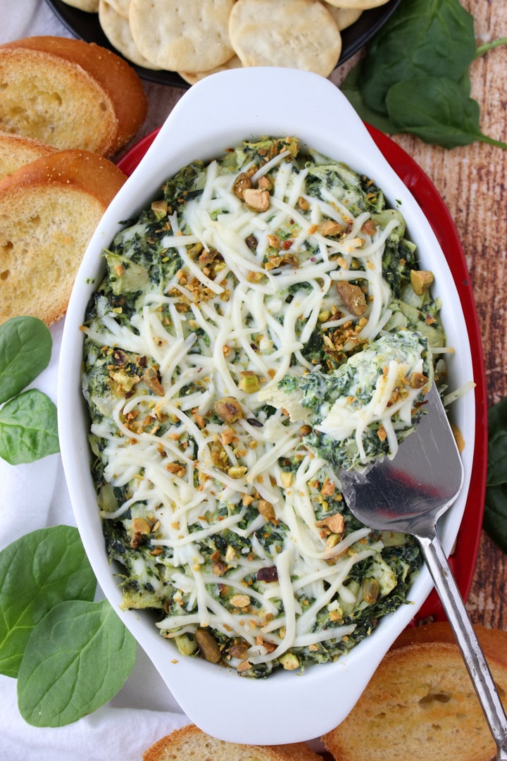 casserole dish with spinach artichoke  dip