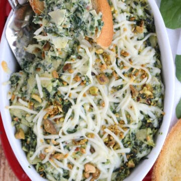 casserole dish with hot spinach artichoke dip