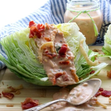 iceberg lettuce wedge with thousand island dressing on top