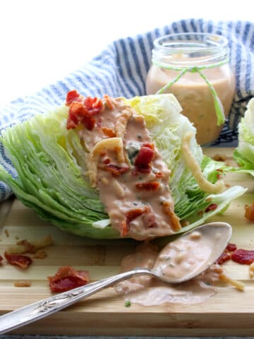 iceberg lettuce wedge with thousand island dressing on top