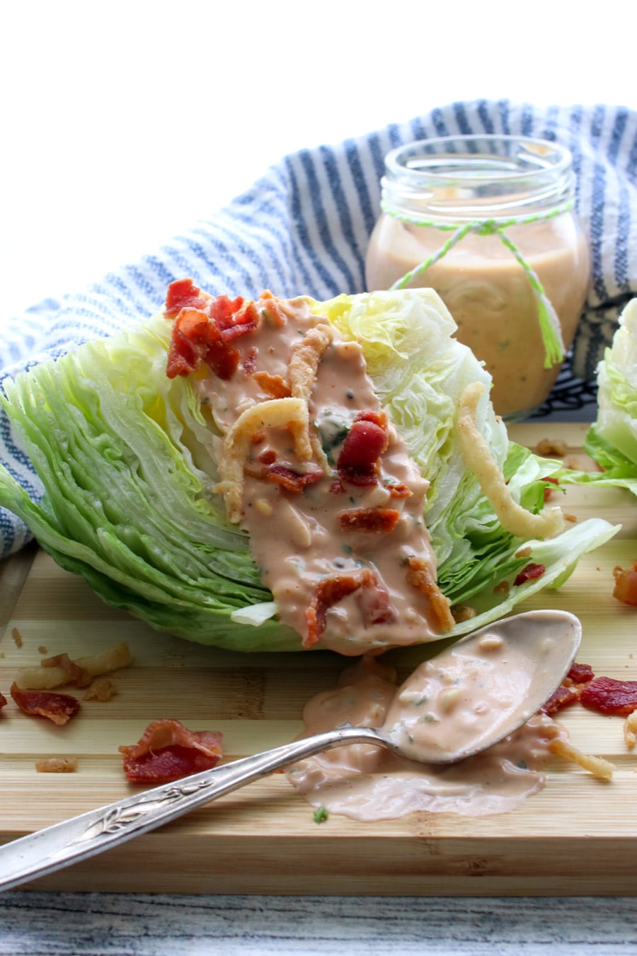 iceberg lettuce wedge with thousand island dressing on top