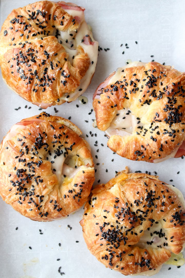 overhead shot of 4 ham and cheese croissant sandwiches