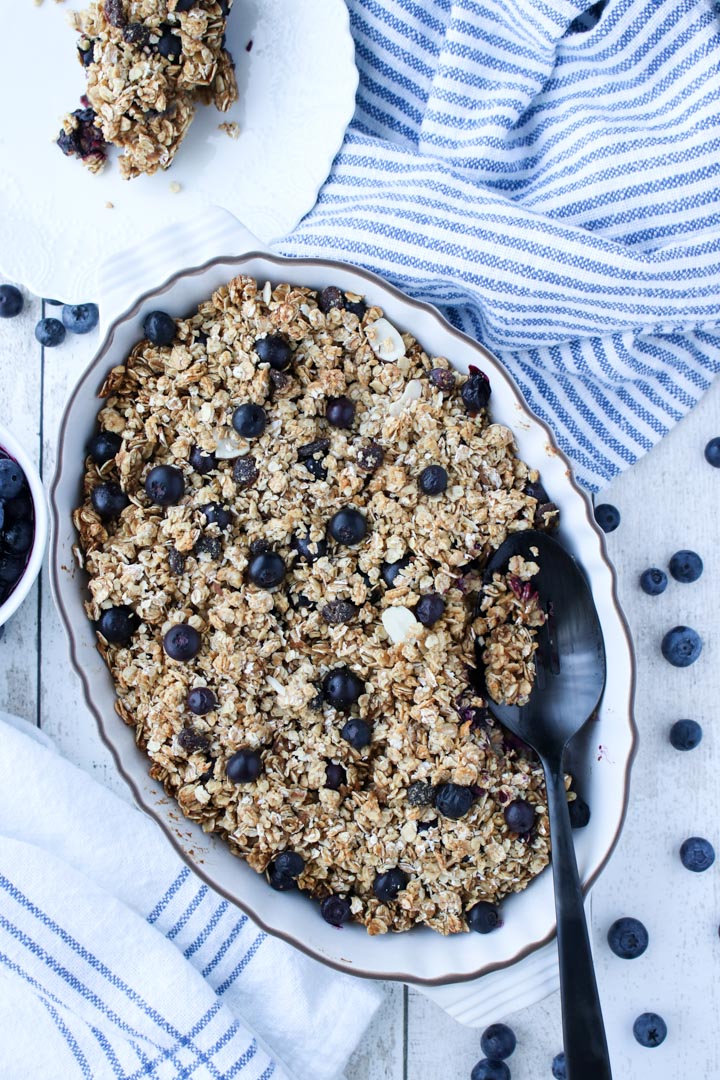 White casserole dish with baked blueberry oatmeal