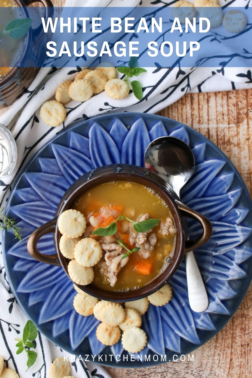 Tender white beans cooked with mild Italian sausage and carrots with a secret ingredient that takes any soup or stew to a new level. via @krazykitchenmom