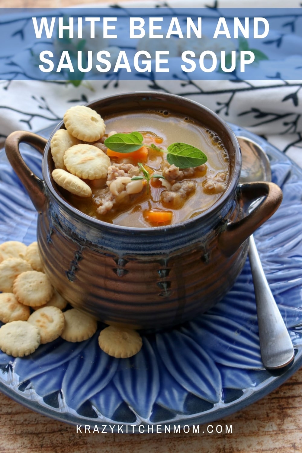 Tender white beans cooked with mild Italian sausage and carrots with a secret ingredient that takes any soup or stew to a new level. via @krazykitchenmom