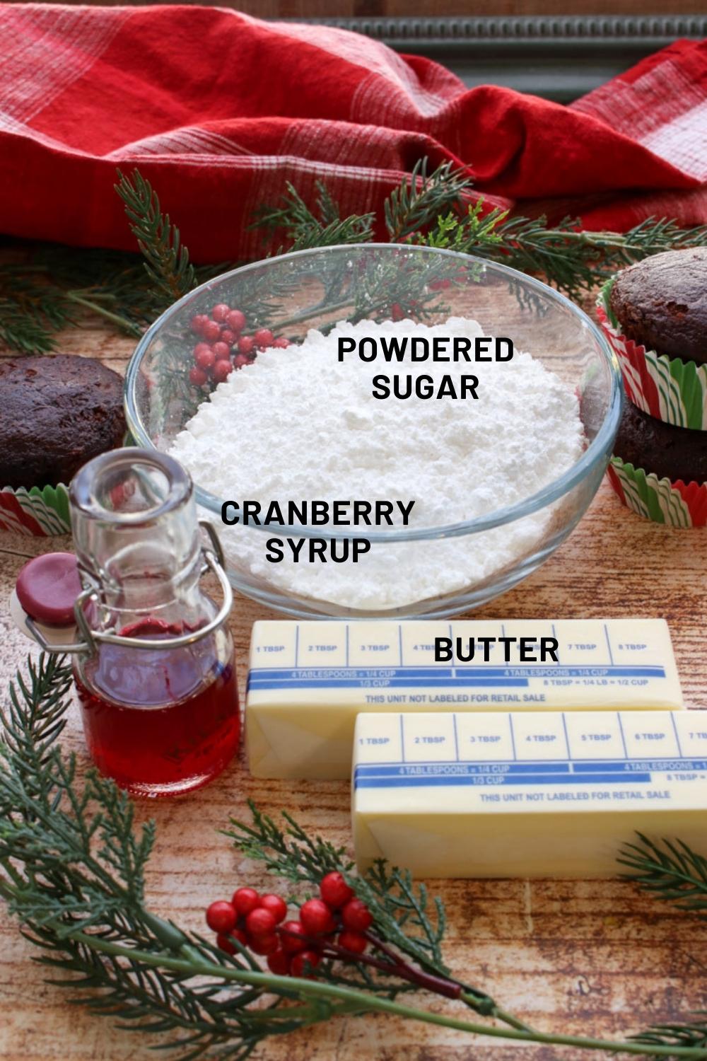 Ingredients to make cranberry buttercream. Powdered sugar, cranberry syrup, butter