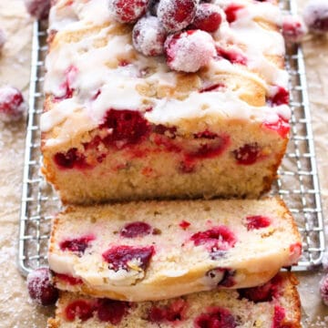 cranberry orange coffee cake with several slice laying in front