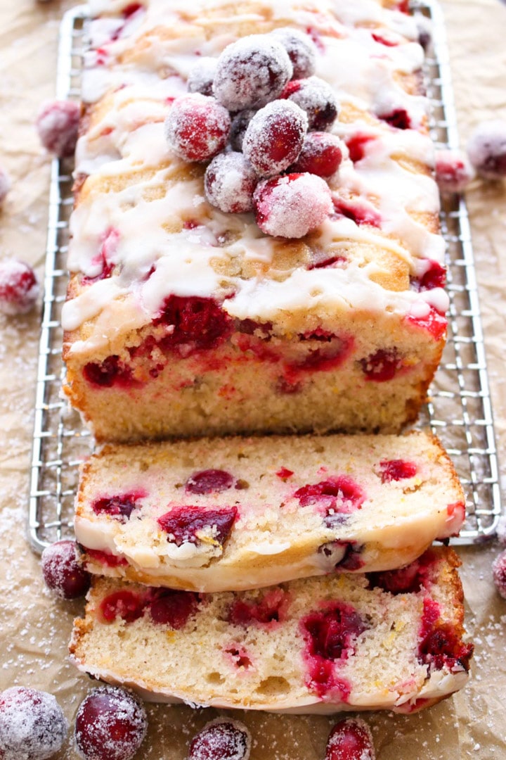 cranberry orange coffee cake with several slice laying in front