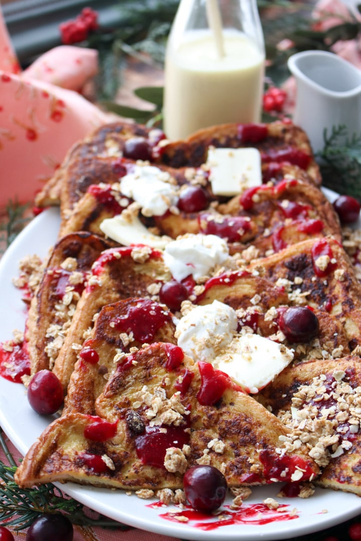 platter of eggnog french toast with butter and sour cream