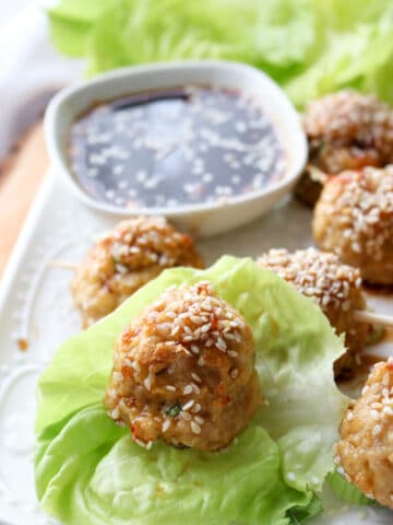 chicken meatball on a lettuce leaf