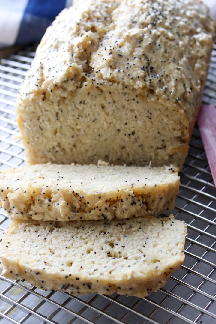 loaf of beer bread with two slices cut from loaf