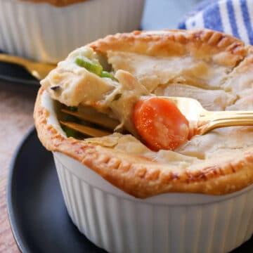 Ramekin or chicken pot pie with a fork full on top