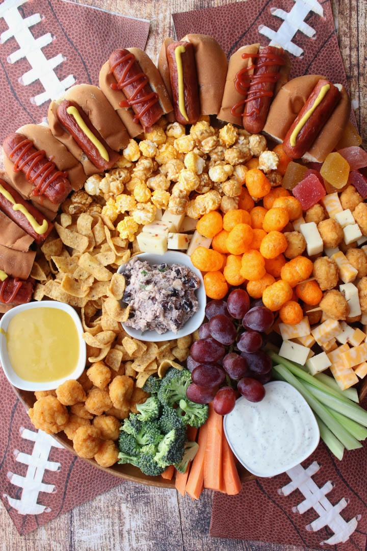 overhead shot of a board filled with snacks and finger foods