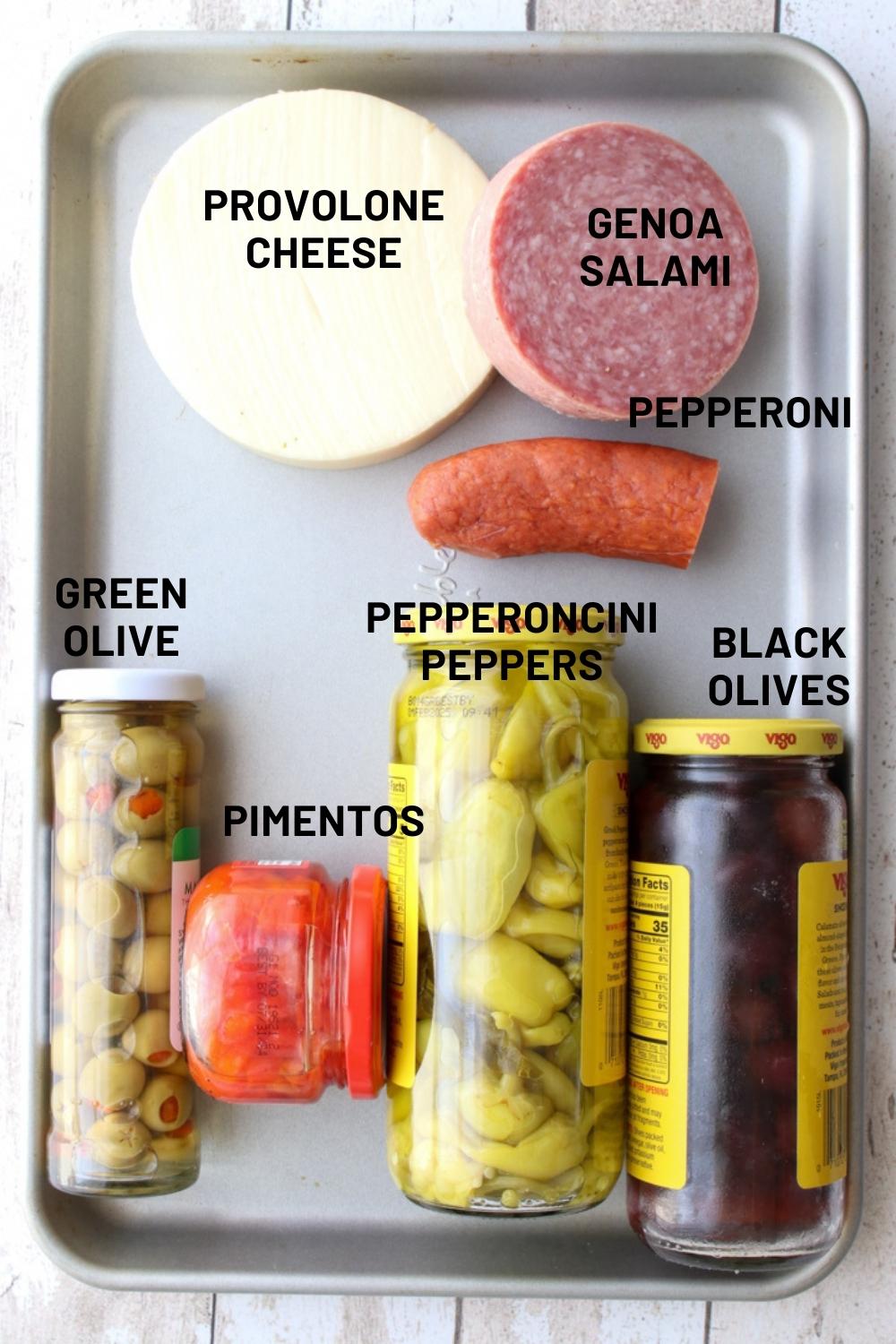 cookie sheet with ingredients to make muffuletta dip