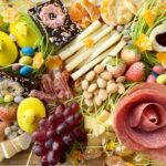 easter charcuterie board filled with cheese, meat, fruit, and candy