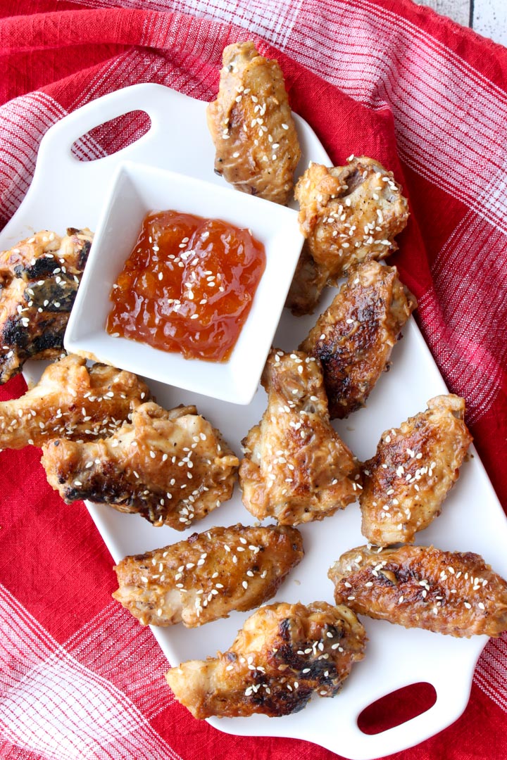 These spicy peanut butter and jelly wings will change the way you think about grilled wings. These are sweet and tangy with a little heat. via @krazykitchenmom