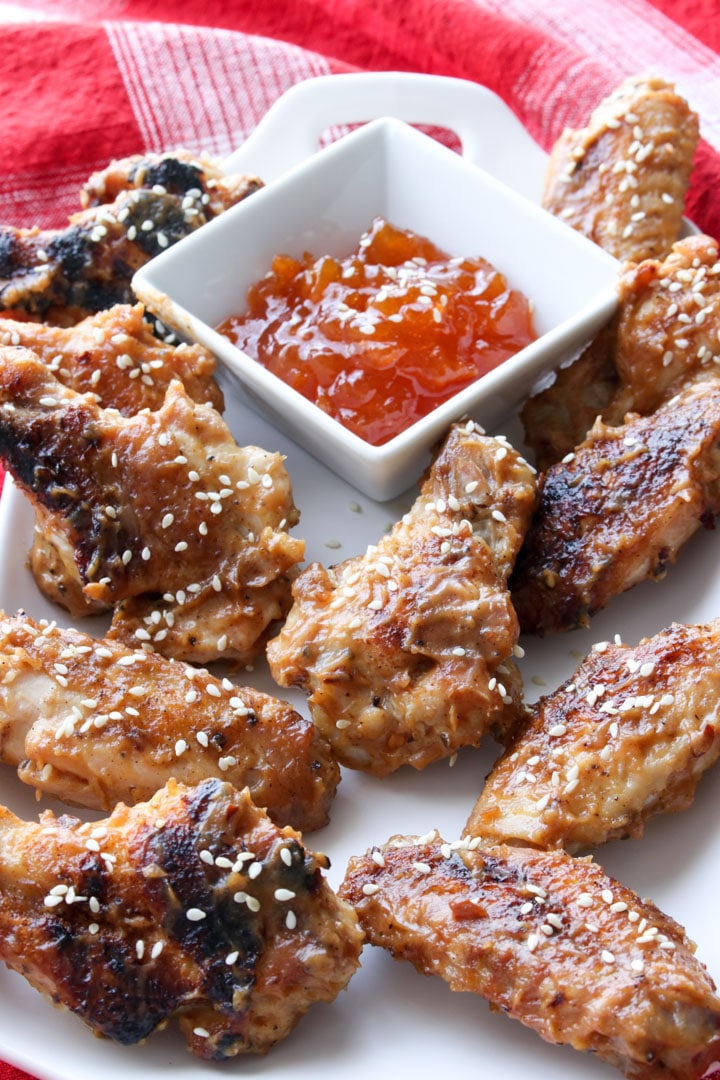 platter of pbj wings with a dish of apricot jam