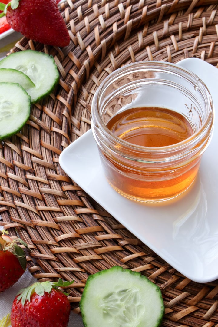 small jar of balsamic vinegar with honey on a white plate