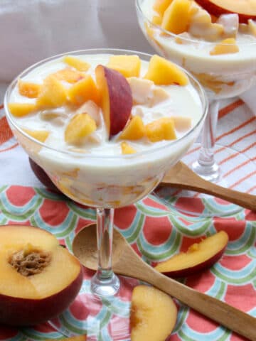 dessert dish with fresh peaches and cream